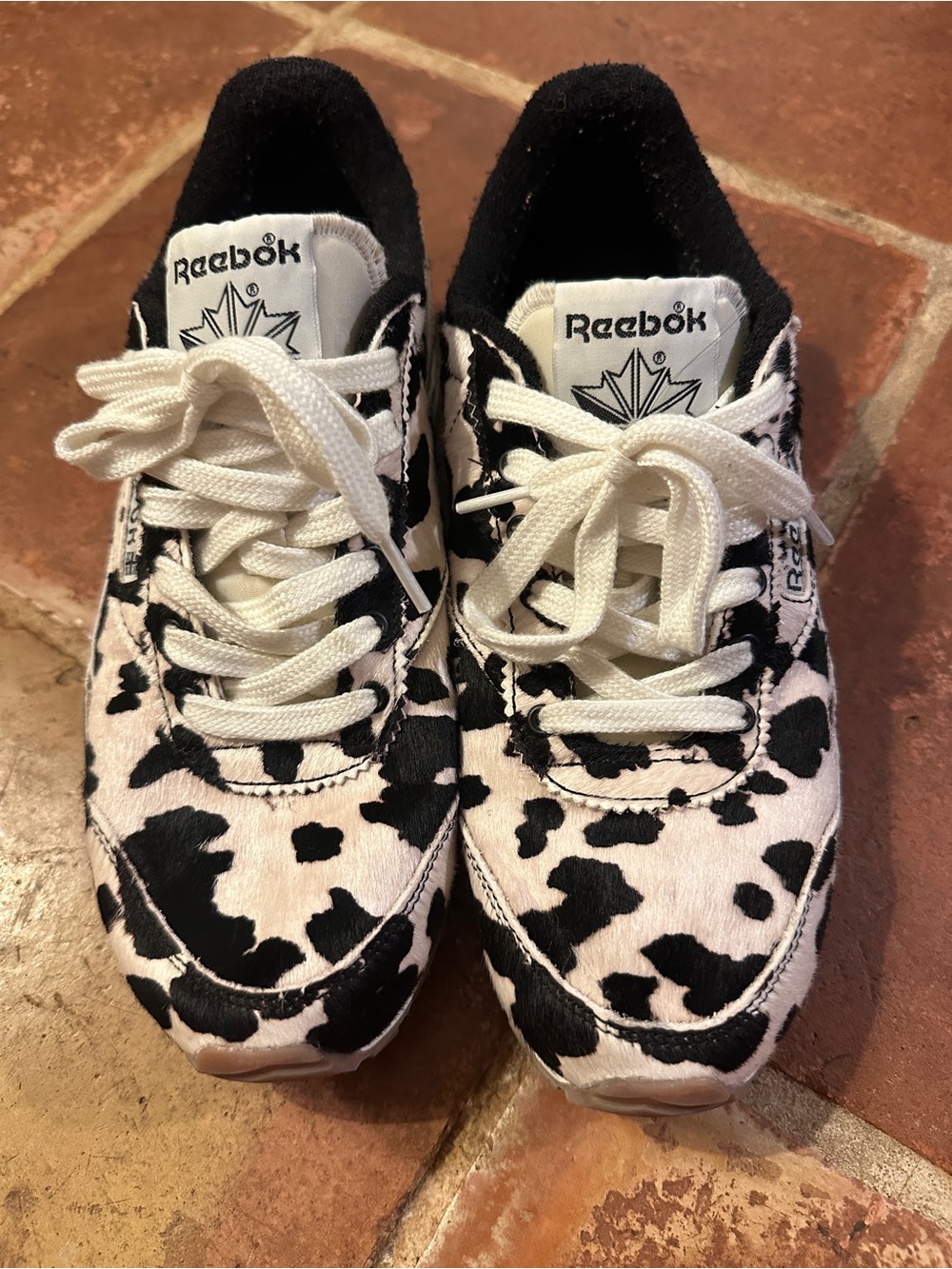 Reebok Cow-Print Sneakers in Black & White